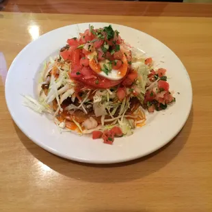 Beef enchilada. More of a tostada. Very yummy!