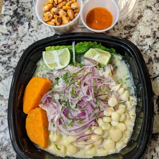 Ceviche de Tilapia ($15.99) - fresh raw diced tilapia marinated in lime juice, served with Peruvian corn, sweet potato, lettuce, and onions.