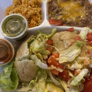 Chicken gorditas, rice, beans and variety of salsas.