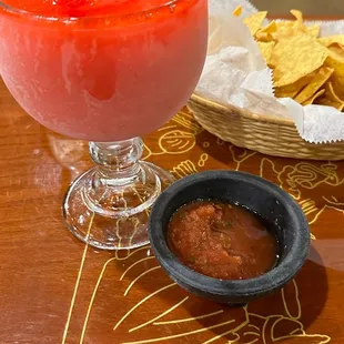 a drink and chips on a table