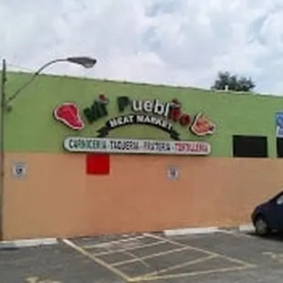 a car parked in front of a restaurant