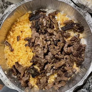 a bowl of rice and meat