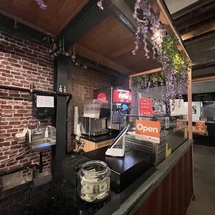 a bar with a brick wall