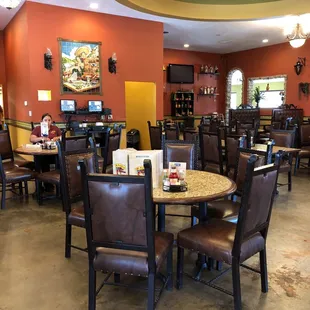 a dining area with tables and chairs