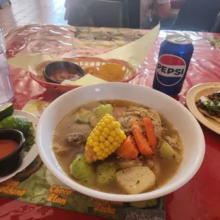 Caldo de Pollo and carne asada taco, condiments, salsa