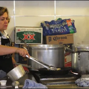 Teresa, co-owner of the restaurant, fries corn tortillas.  I asked her what was in the pot, and she told me the large one has chili roja,