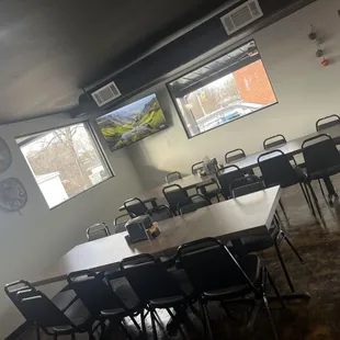 a room with tables and chairs