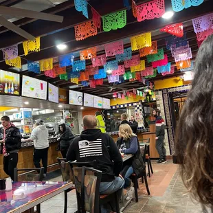 a mexican restaurant filled with people