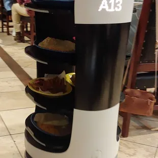 Robot waiter assistant food server- number on back identifies table destination