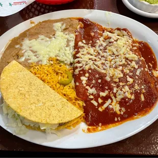 Combination beef taco and two cheese and onion enchiladas.