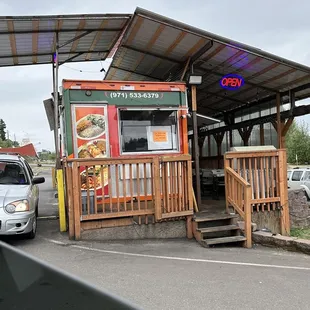 Drive through and deck porch area to sit