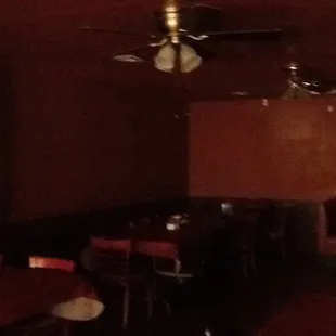 a dining room with a ceiling fan