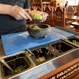 a man preparing food in a restaurant