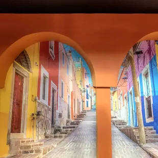 A vibrant mural welcomes all who enter