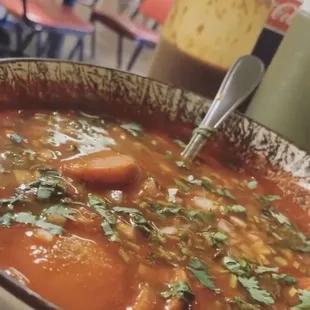 a bowl of soup with a spoon in it