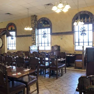 a dining room with tables and chairs