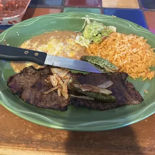 Carne Asada Plate that costs $18 now! You can get a steak at a steakhouse for cheaper than this thin, small piece.