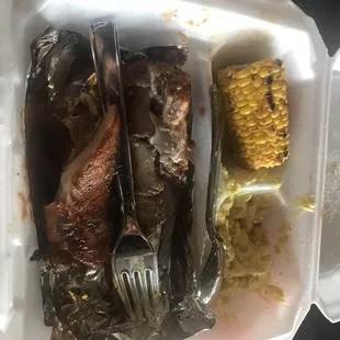 Barbecue ribs, potato salad corn and some vegetables awesome food.