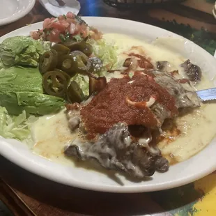 One of our keto faves..rolled steak with bacon, cheese, double salad, no rice and beans, BYO zero carb tortillas!!