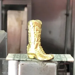 The cowboy boot toeing the cash.