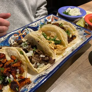  plate of tacos and a bowl of salsa