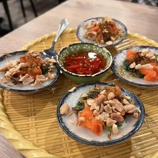 four plates of food on a tray