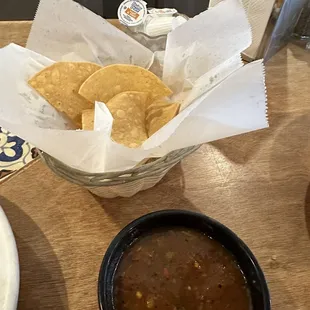 a bowl of chili and tortilla