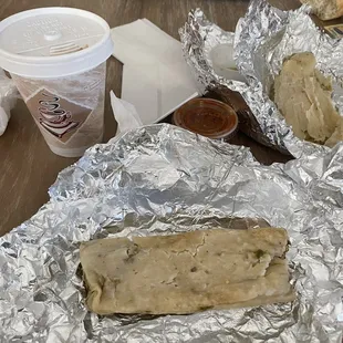 a burrito and a cup of coffee