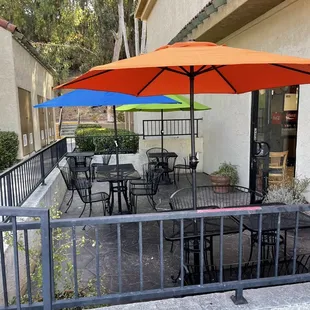 Outside: view of the dedicated outdoor patio featuring newly refreshed table umbrellas