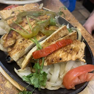 a plate of chicken and vegetables