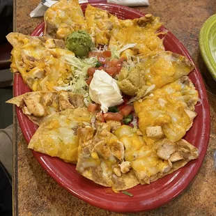 a plate of nachos on a table