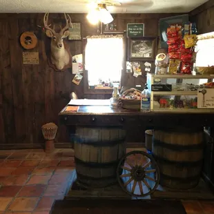 a bar with a deer head on the wall