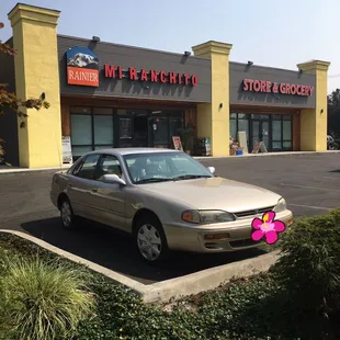 a car parked in front of a store