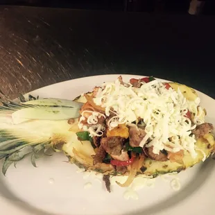 a white plate with a pineapple on it