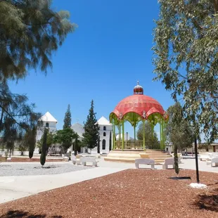 a gazebo in the middle of a park