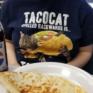 The Kid ( aka Tacocat) and her quesadilla.