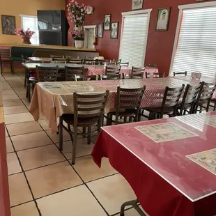 a dining room with tables and chairs