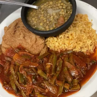a plate of food with beans and rice
