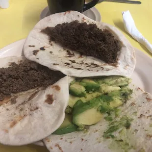 Avocado, barbacoa, picadillo tacos.