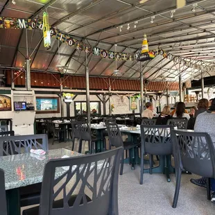 the inside of a restaurant with tables and chairs