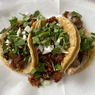 two tacos on a white plate