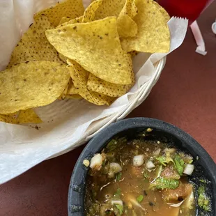 a bowl of soup and chips