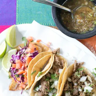 [from left to right] Fish;  picadillo (ground beef) and steak tacos