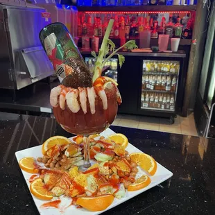 a cocktail being poured into a cocktail glass