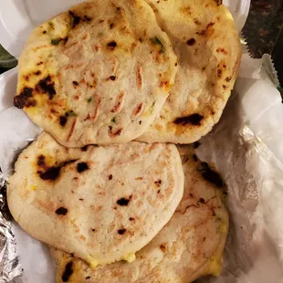 three tortillas in a container
