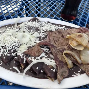 Enfrijoladas with Tasajo.