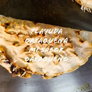 TLAYUDA:  aciento de puerco frijoles queso repollo aguacate  y carne asada de res