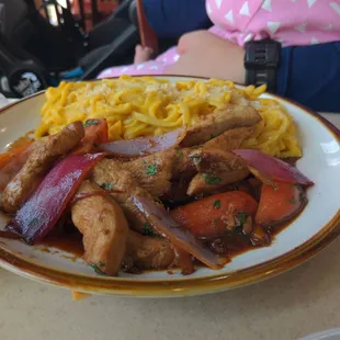 Lomo saltado with huacaina sauce