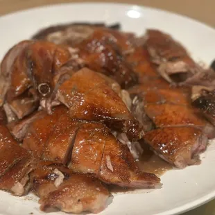 a plate of chicken with sauce