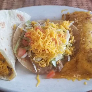 Ladies plate $7 something. Beef taco (chose flour), bean tostada, shredded chicken enchilada